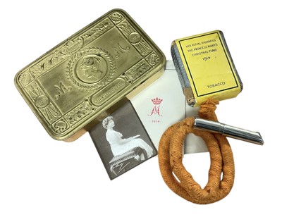 Lot 121 - First World War Princess Mary Gift tin with original contents comprising Christmas card, photograph of Princess Mary, tobacco packet and rare tinder lighter by Asprey, London.