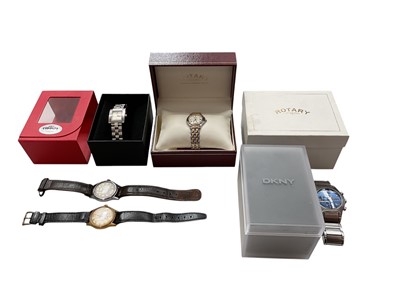 Lot 1110 - Five wristwatches to include a Rotary bi-metal ladies watch, Tissot stainless steel ladies quartz watch, DKYN stainless steel watch, all boxed with spare links and papers