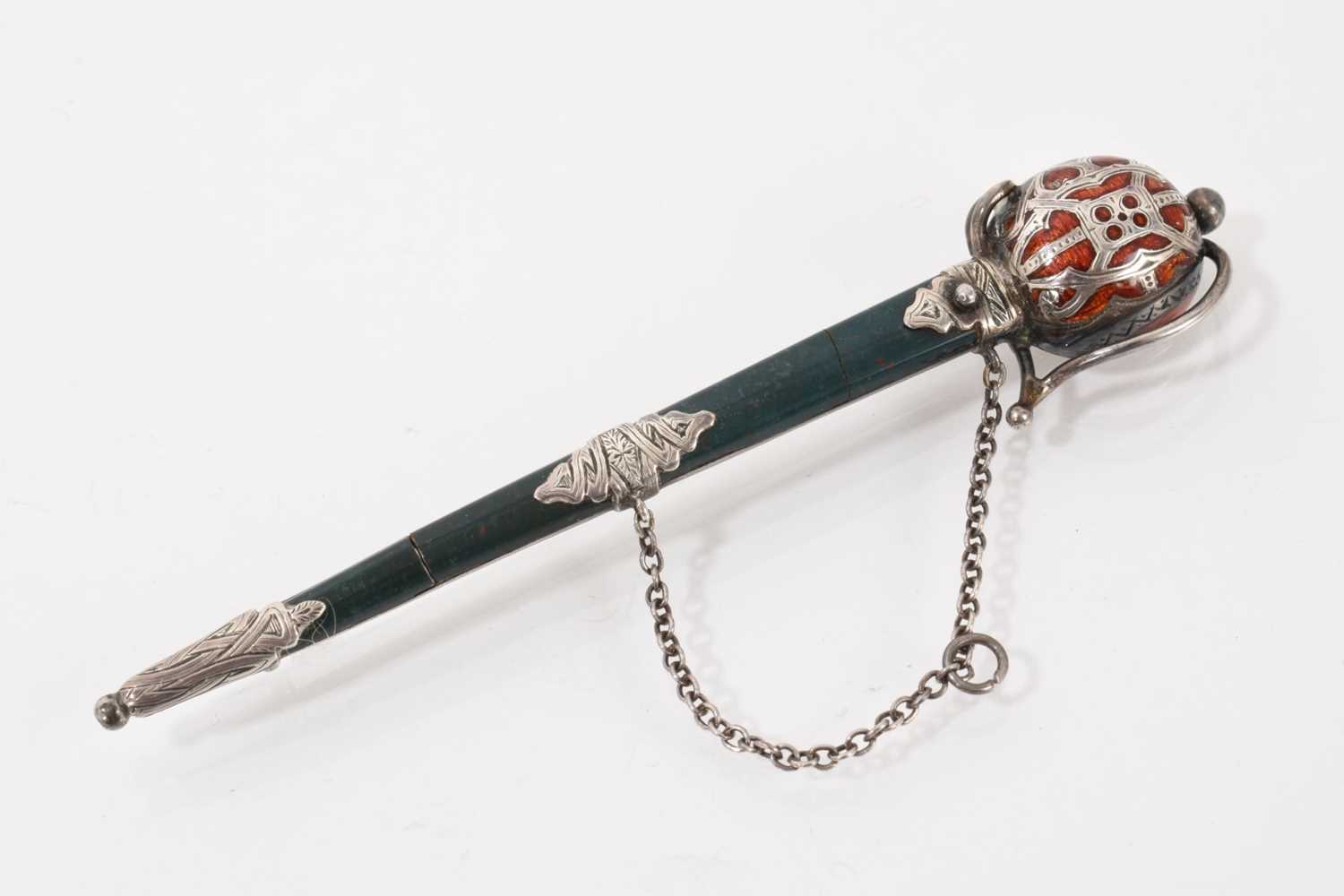 Lot 546 - Scottish silver and bloodstone sword brooch with enamel decoration to the hilt, 9.5cm long