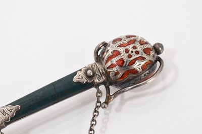Lot 546 - Scottish silver and bloodstone sword brooch with enamel decoration to the hilt, 9.5cm long