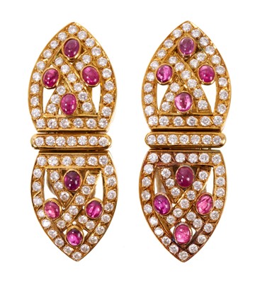Lot 559 - Pair of Art Deco style gold diamond and cabochon ruby earrings each with an articulated lozenge shaped pierced plaque
