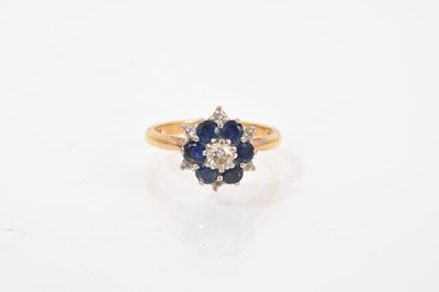 Lot 571 - Sapphire and diamond flower head cluster ring
