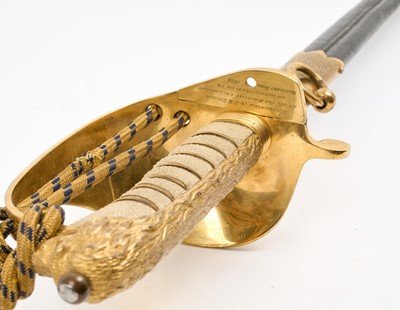 Lot 67 - Good George VI Naval Officer's dress sword with gilt lion's head pommel, wire bound shagreen grips, Gothic guard with crowned fouled anchor and original bullion dress knot, etched fullered blade...