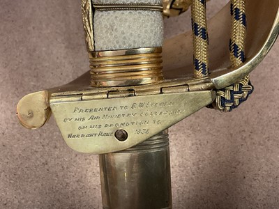 Lot 67 - Good George VI Naval Officer's dress sword with gilt lion's head pommel, wire bound shagreen grips, Gothic guard with crowned fouled anchor and original bullion dress knot, etched fullered blade...