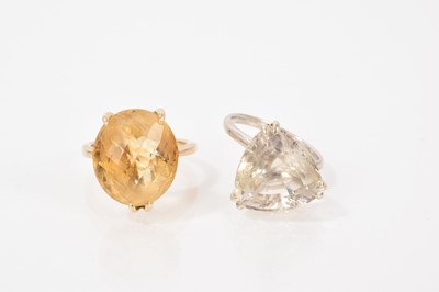 Lot 617 - Oval fancy cut citrine ring in yellow gold mount and one other dress ring with a triangular quartz (2)