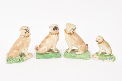 Lot 186 - Four Derby porcelain pug dogs, circa 1800, polychrome painted with gilt collars, 6cm to 9cm high