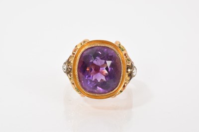 Lot 656 - Amethyst and diamond signet ring with a cushion cut amethyst measuring approximately 14 x 13mm, in gold mount with rose cut diamonds to the shoulders, ring size N-O.