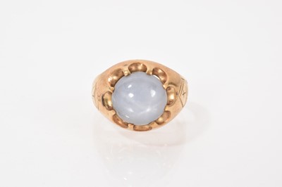 Lot 660 - Gold and gem-set 'bishop' ring with a cabochon star sapphire in gold setting with engraved bishop's mitre, ring size P.