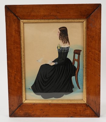Lot 988 - Late Regency watercolour portrait miniature on paper, seated girl reading
