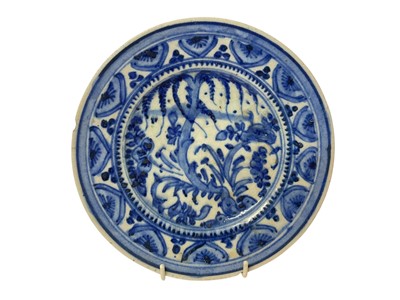 Lot 203 - Persian blue and white tin glazed dish, painted with foliage, 21.5cm diameter