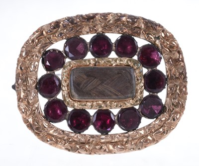 Lot 668 - Large Regency gilt metal and garnet mourning brooch