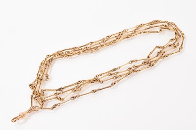 Lot 674 - Late Victorian gold/yellow metal guard chain with fancy links, marked ‘15’