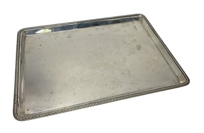 Lot 95 - Late Victorian silver rectangular tray with decorative border, (London 1900), makers mark rubbed, 33.4cm in length, 22ozs.