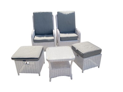 Lot 1339 - Pair of rattan-type garden chairs with stools and a table