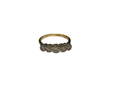 Lot 234 - 18ct gold dimaond five stone ring in a platinum illusion setting