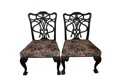 Lot 1297 - Pair of George II-style mahogany side chairs with ribbon-tied pierced backs and upholstered seats