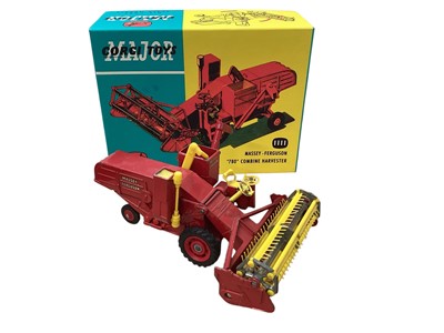 Lot 1575 - Corgi Major Toys Massey Ferguson 780 Combine Harvester with yellow tines, No.1111 (one back wheel damaged) & Ford Tilt Cab "H" Series with detachable trailer No.1137, both in reproduction bo...