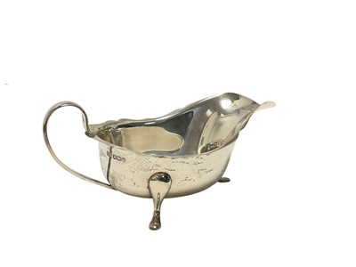 Lot 227 - George VI silver sauceboat of helmet form, raised on three pad feet, (Sheffield 1938), maker Viners, 18cm in length, all at approximately 5ozs.