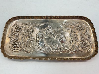 Lot 1126 - Victorian silver pen tray with embossed scroll decoration depicting figures seated at a table