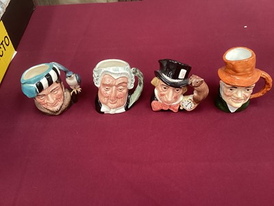 Lot 964 - Two Royal Doulton figures - Au Revoir HN3723 and Hello Daddy HN3651, together with 12 Doulton character jugs and three others