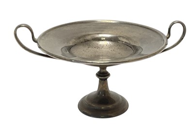 Lot 96 - Edwardian silver tazza with twin loop handles, raised on a pedestal base, (London 1905), maker Holland, Aldwinckle & Slater, 8.4cm in height, 4.5ozs