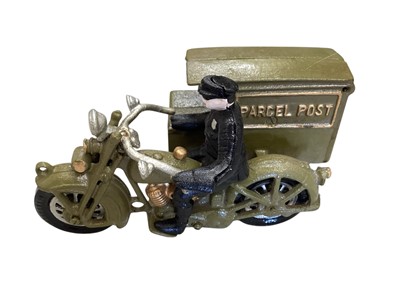 Lot 1679 - Reproduction cast iron Parcel Post Motorcyclist & His Master's Voice Dog, plus tinplate miltiary ambulance (3)