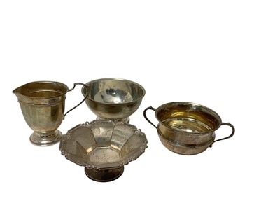 Lot 111 - George V silver Bon Bon dish, (Birmingham 1931), together with two silver bowls and a silver jug (various dates and makers), all at 8ozs.