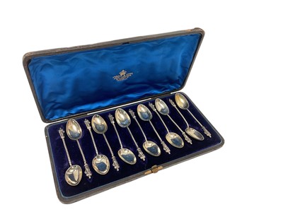 Lot 178 - Set of twelve Victorian silver Apostle teaspoons in fitted case, (Birmingham 1890), maker George Unite, all at ozs