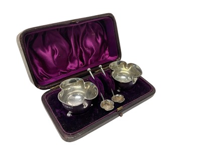 Lot 172 - Pair of Victorian silver salts of shaped form with beaded borders, on ball feet, with matching spoons, in original fitted case, (Birmingham 1883) all at 1.2ozs