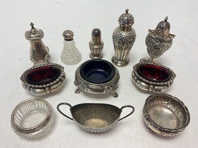 Lot 1053 - Group of silver pepperettes and salt cellars (11)