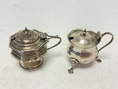 Lot 1057 - Two silver mustard pots with blue glass liners