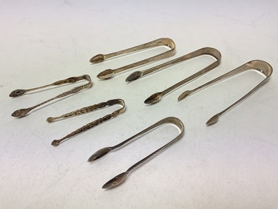 Lot 1058 - Six Georgian and later silver sugar tongs
