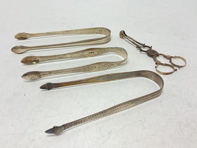 Lot 1059 - Three pairs of various Bateman silver sugar tongs and a pair of silver sugar tongs (4)