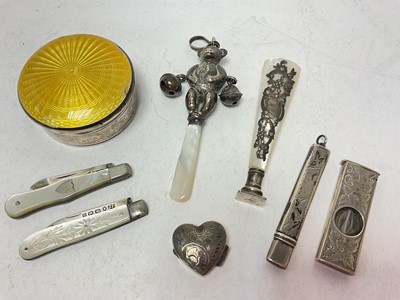 Lot 1063 - Silver and mother of pearl child's bear rattle, silver and mother of pearl desk seal, two silver and mother of pearl fruit knives, silver and yellow enamel pot and other silver items