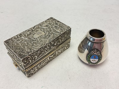 Lot 1068 - Silver curling tong box with embossed decoration and a silver pot with enamelled crest (2)