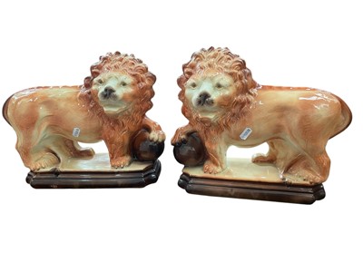 Lot 235 - Pair of Staffordshire models of lions
