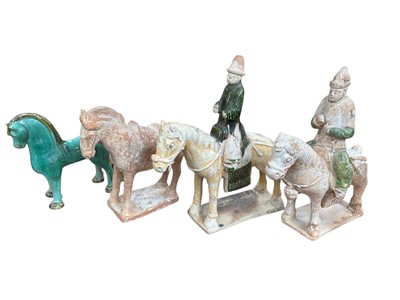 Lot 243 - Three Chinese tang style terracotta figures of horses/horseman