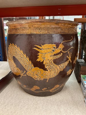 Lot 351 - Oriental pottery jardinère with dragon decoration