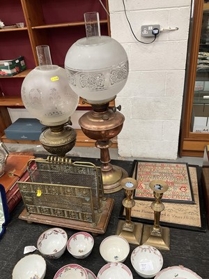 Lot 134 - Two oil lamps, other brass and two samplers