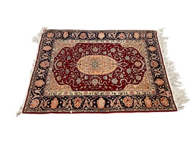 Lot 1318 - Good quality silk rug on red and blue ground