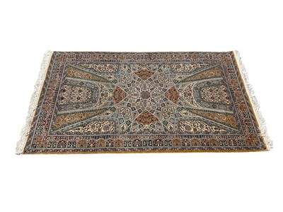 Lot 1319 - Good quality silk rug on gold and green ground