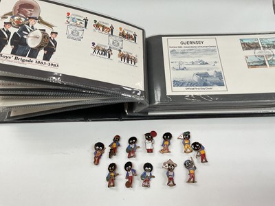 Lot 343 - Album of Guernsey First Day Cover and a collection of enamelled Golly badges