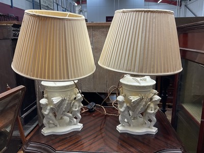 Lot 167 - Pair of Moore Brothers type pottery lamps with putto ornament
