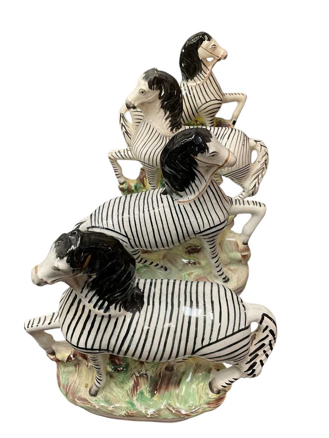 Lot 154 - Two pairs of Staffordshire zebras