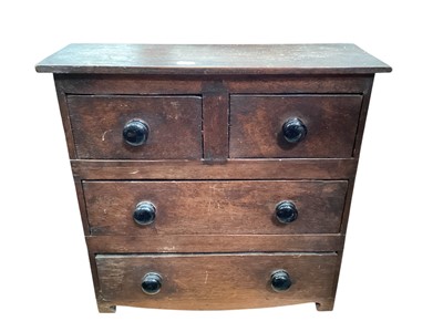 Lot 1232 - Early 19th century miniature chest of three long drawers