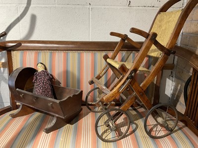 Lot 697 - 19th century miniature model of a cot with 19th century peg doll