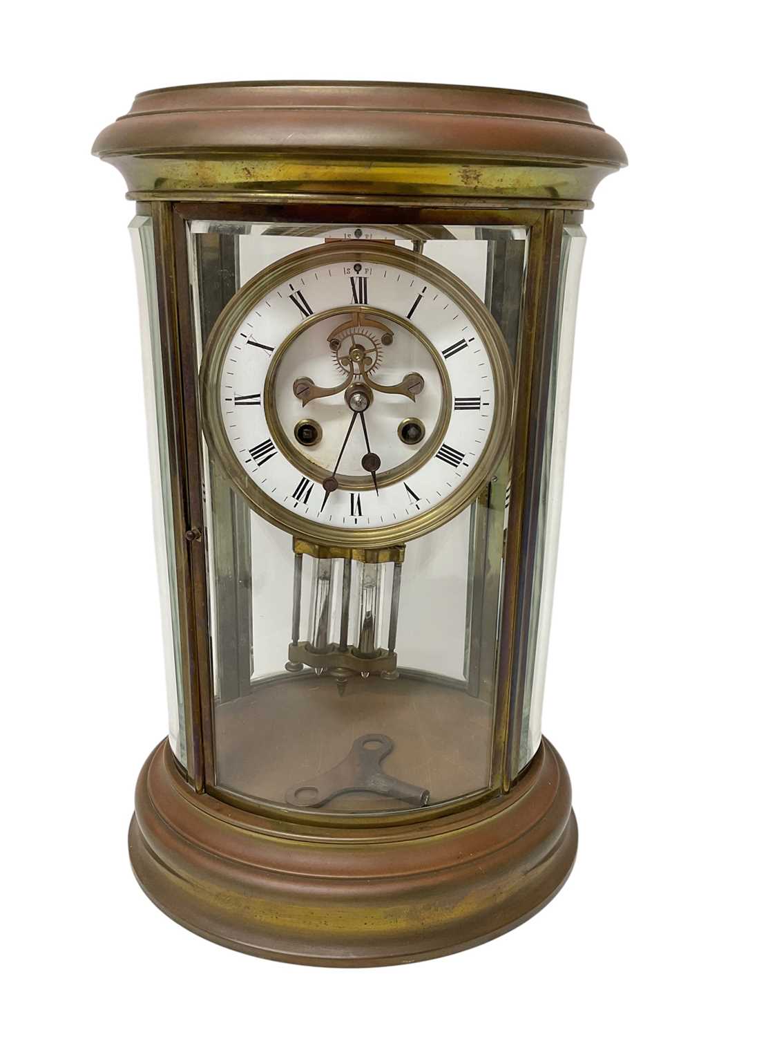 Lot 818 - French oval brass cased four glass mantel clock