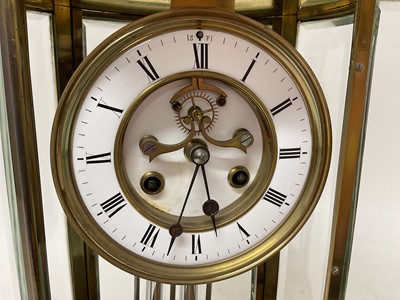 Lot 818 - French oval brass cased four glass mantel clock