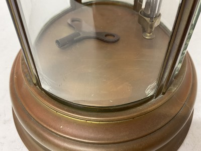 Lot 818 - French oval brass cased four glass mantel clock