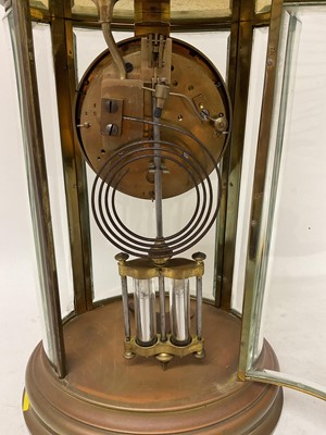 Lot 818 - French oval brass cased four glass mantel clock